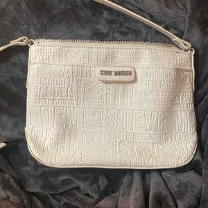 White Steve Madden cross body purse.